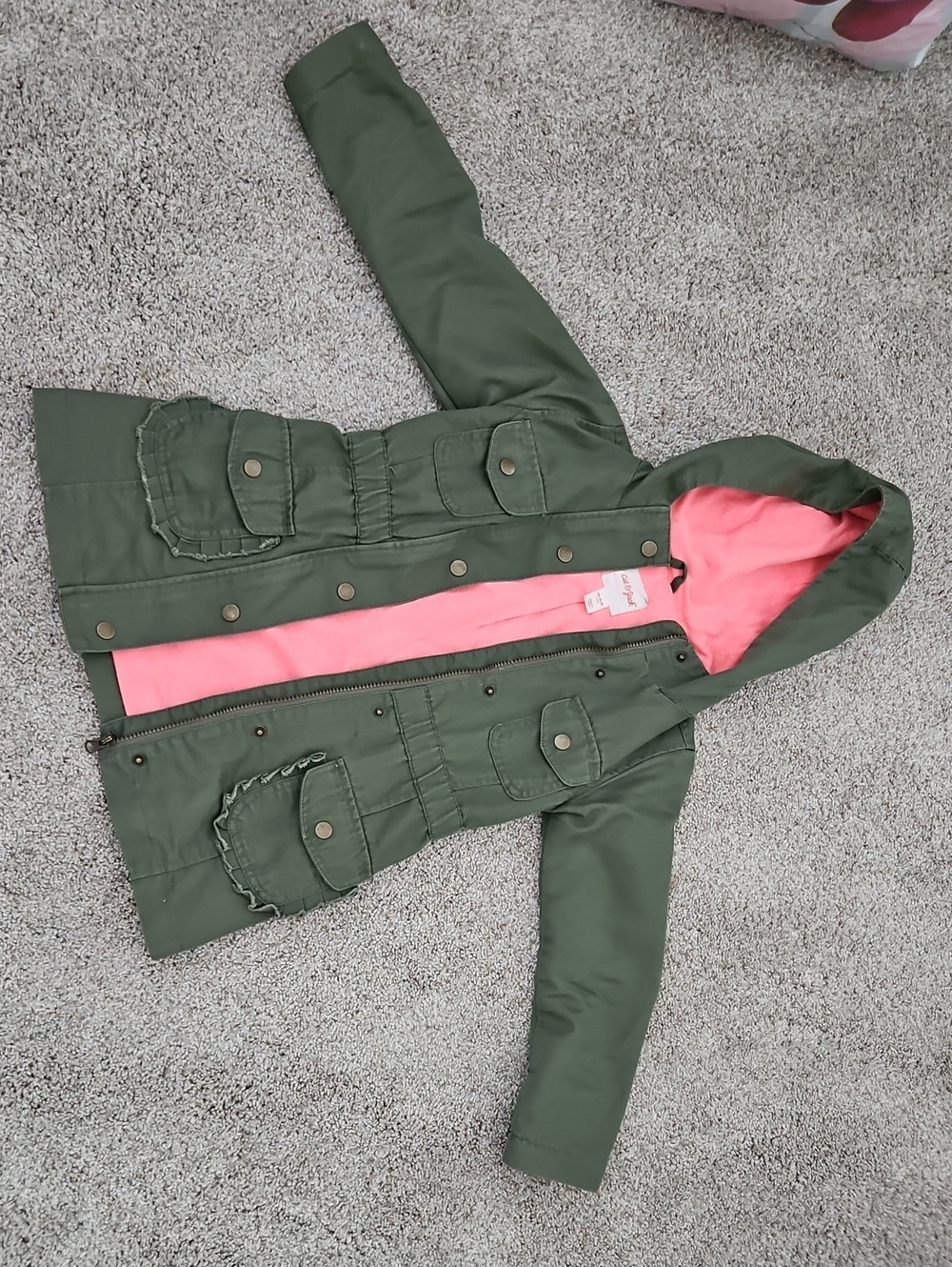 Lighweight Olive Hooded Jacket with Pink Lining. 67% Cotton, 33% Polyester.